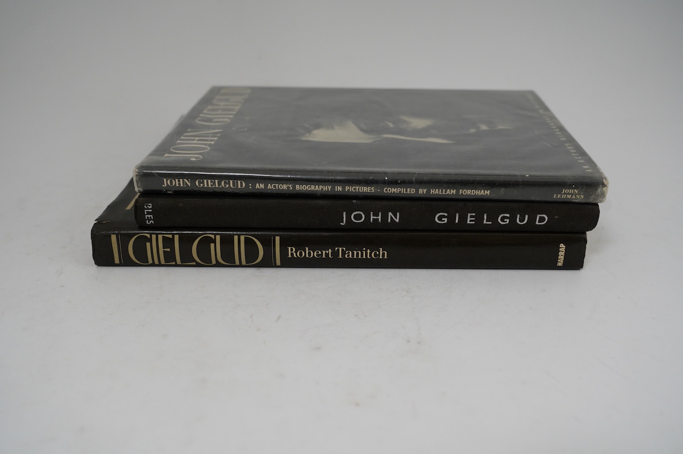 A theatrical archive of signed photos, a poster and books relating to John Gielgud and Laurence Olivier, including; a framed signed photograph of John Gielgud as Hamlet dated 1935, together with two signed photographs da